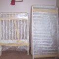 Putting the crib together (1)